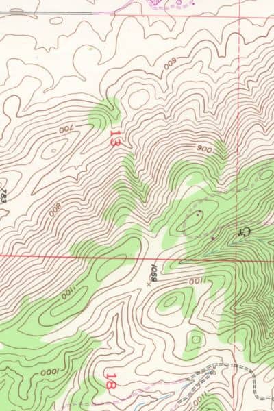 Topographic survey map showing contour lines and elevation changes on sloped terrain