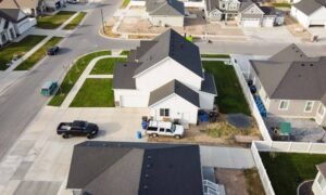 Aerial view of a growing neighborhood where a licensed land surveyor helps confirm property boundaries