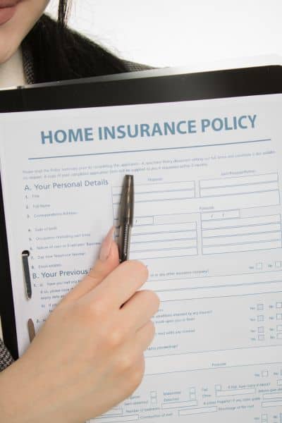 Home insurance policy form showing how a flood elevation survey can impact premiums and mortgage requirements
