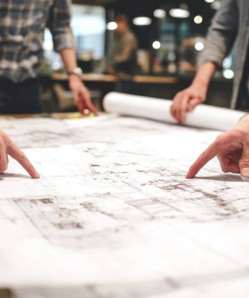 Team reviewing an ALTA Title Survey map and property boundaries to verify accuracy after a court ruling