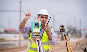Road surveyor total station - ALTA SURVEY Utah Surveyor using equipment to perform a construction survey on a road project site