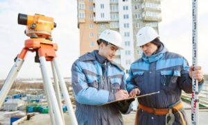 Survey crew performing an as-built survey and site verification at a completed commercial property